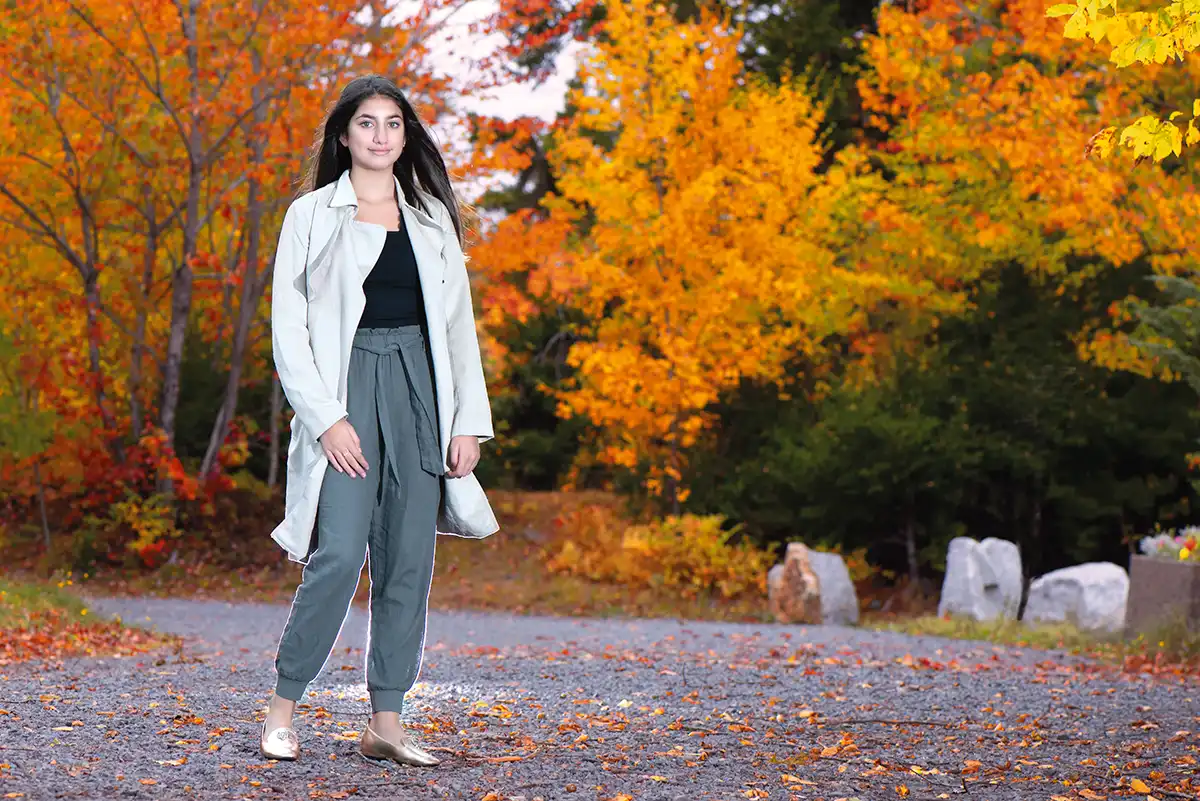Photo of a young lady with the fall foliage in the background. Photo taken by Halifax photographer at the Dingle in Halifax