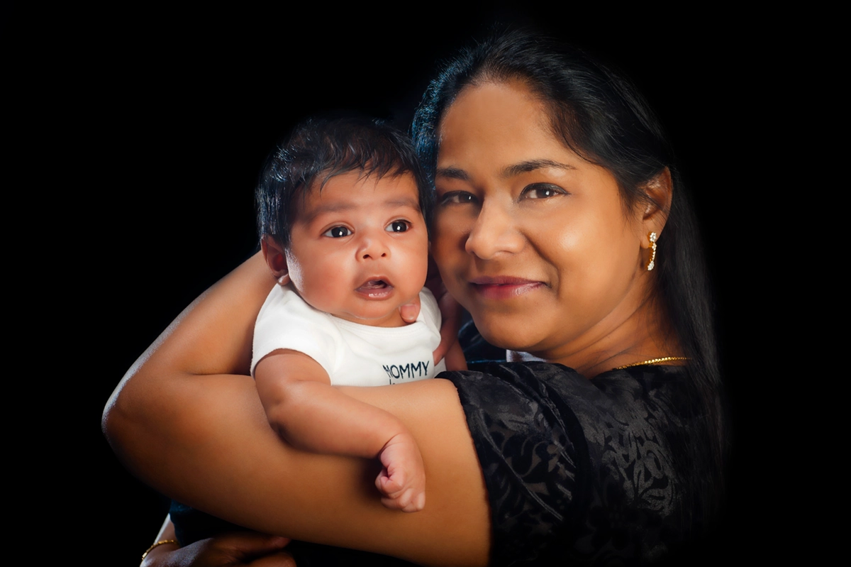 Mommy and Me Portraits Halifax - Mother hugging baby close in studio