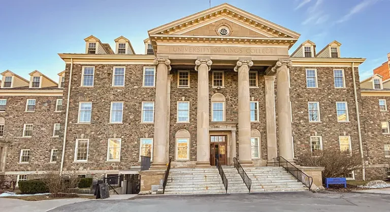 Authentic University of King's College hoods and gowns available in-studio at Moments in Time Photography Halifax – historic King's College building backdrop for graduation portraits