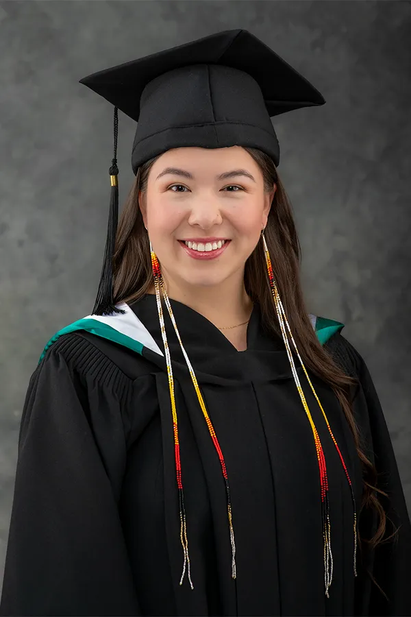 Indigenous Dalhousie University graduate in official academic regalia and traditional Indigenous stole in Halifax.